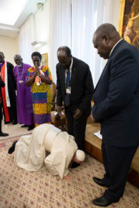 Pope Kisses shoes of South Sudanese president Salvar Kiir